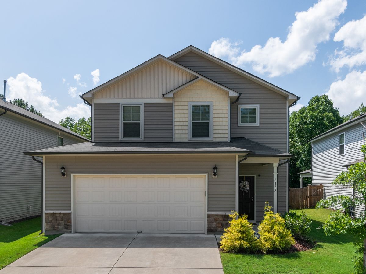 Newly built two-story home with an attached garage